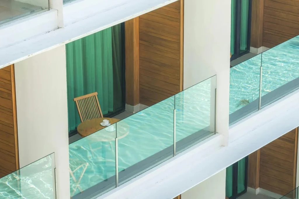 Frameless standoff balcony — pool view